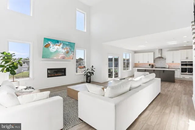 a view of workspace with wooden floor windows