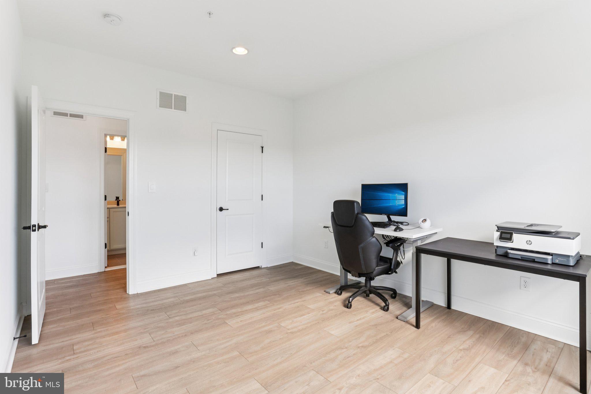 222 Grv Vly Court Chalfont, PA 18914 - Photo 18 of 46 a view of a workspace with furniture and a window