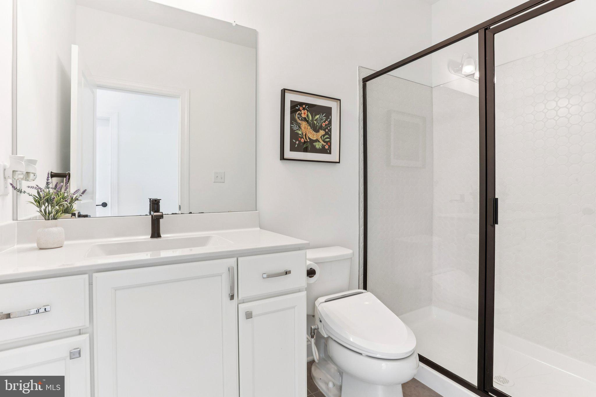 222 Grv Vly Court Chalfont, PA 18914 - Photo 19 of 46 a bathroom with a toilet a sink and a mirror
