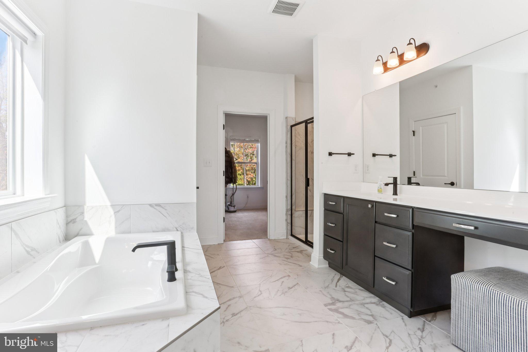 222 Grv Vly Court Chalfont, PA 18914 - Photo 25 of 46 a spacious bathroom with a tub sink and mirror