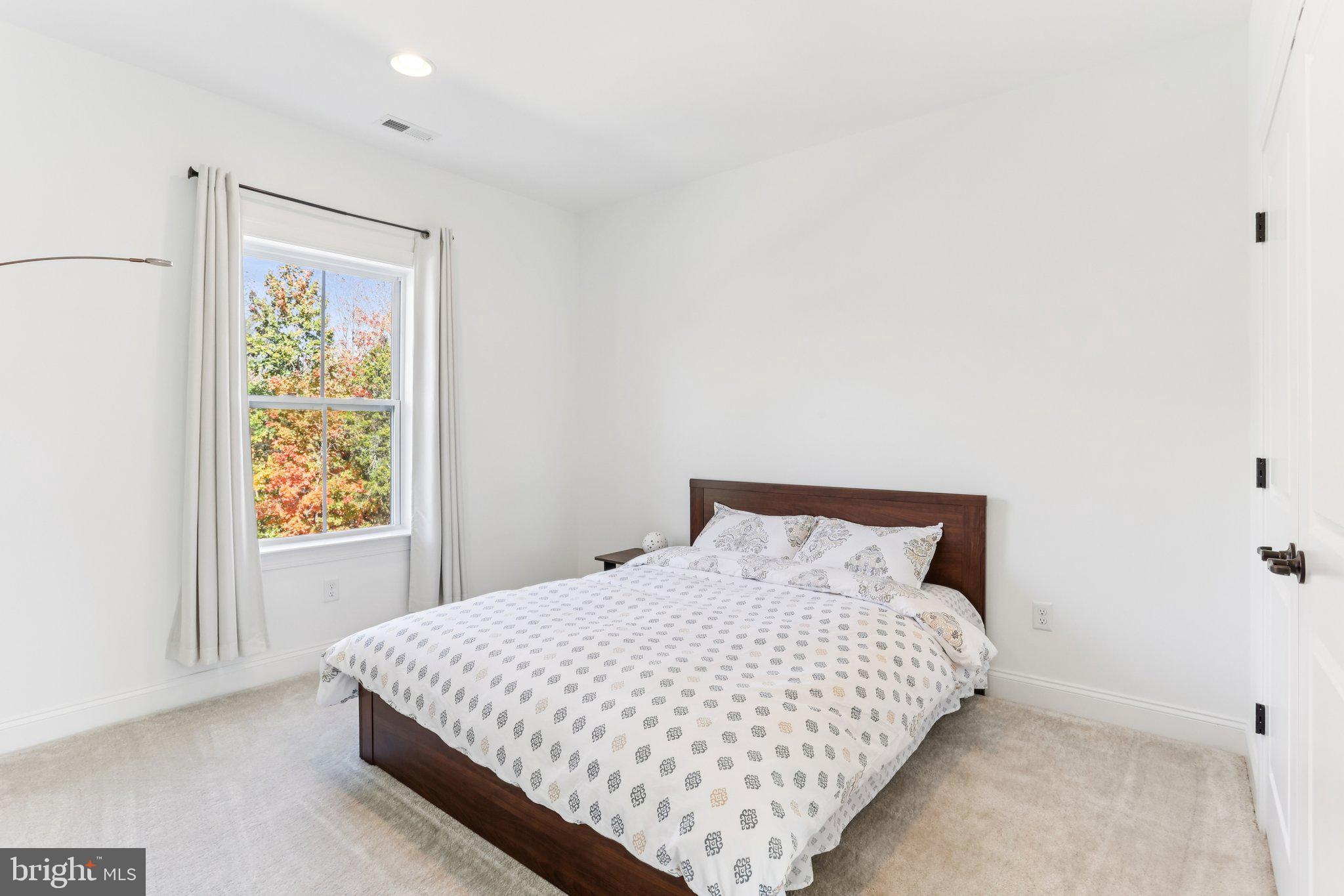 222 Grv Vly Court Chalfont, PA 18914 - Photo 30 of 46 a large bed sitting in a bedroom next to a window