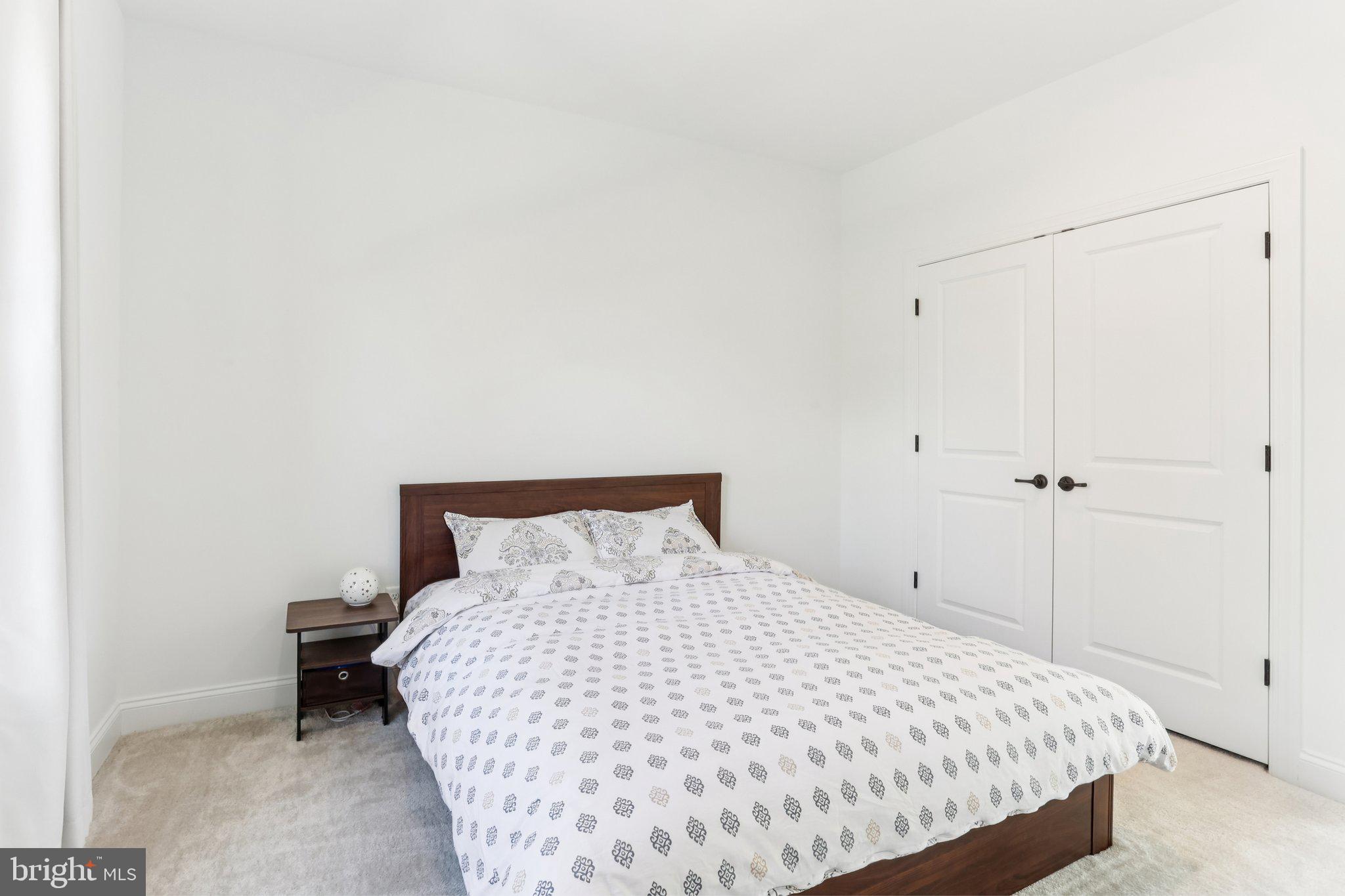 222 Grv Vly Court Chalfont, PA 18914 - Photo 31 of 46 a large bed sitting in a bedroom next to a bathroom