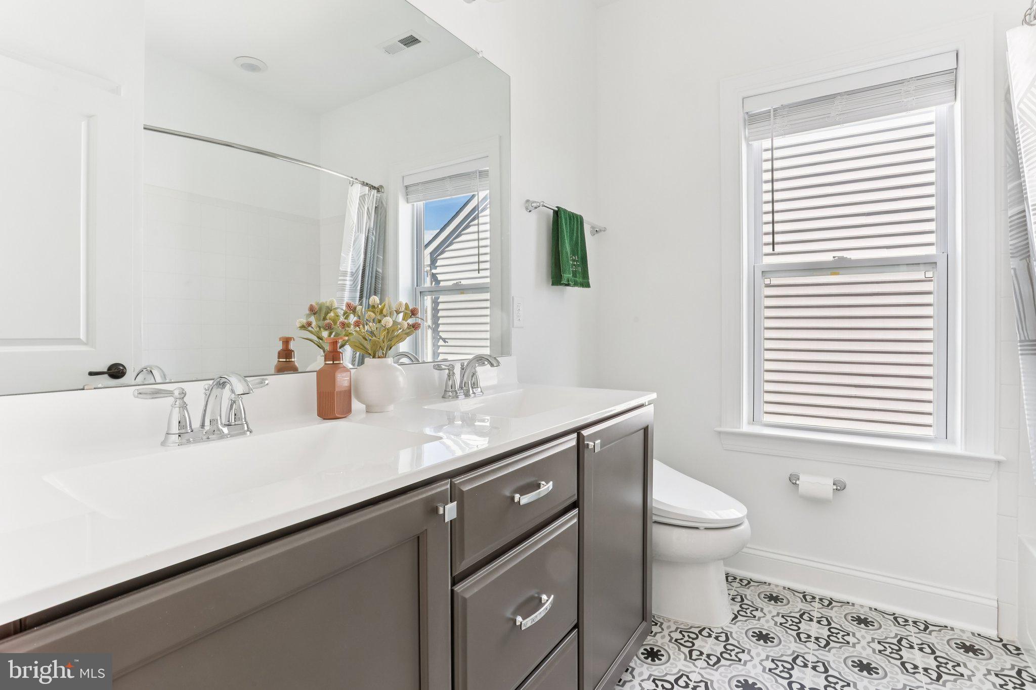 222 Grv Vly Court Chalfont, PA 18914 - Photo 32 of 46 a bathroom with a granite countertop sink a toilet and a mirror