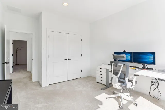 a view of an empty room with windows