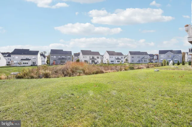 a view of house with yard