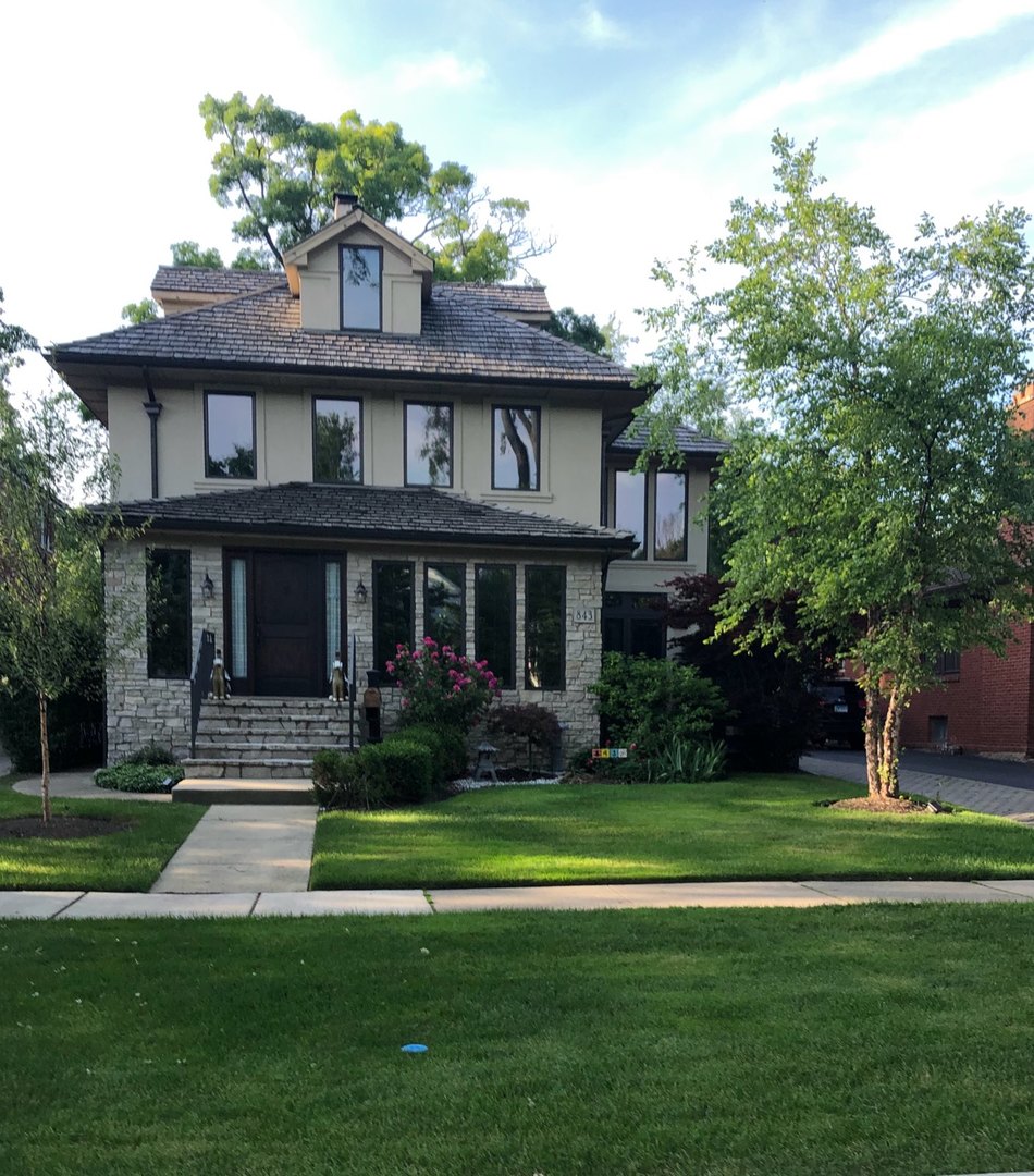 843 Cherry Street Winnetka, IL 60093 - Photo 1 of 9 a front view of a house with a yard