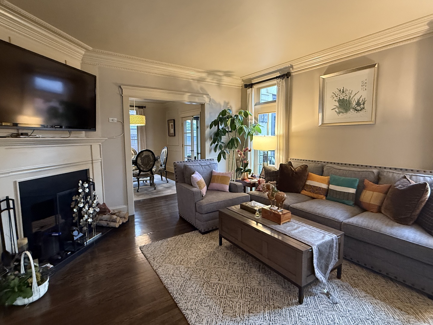843 Cherry Street Winnetka, IL 60093 - Photo 2 of 9 a living room with furniture a flat screen tv and a fireplace