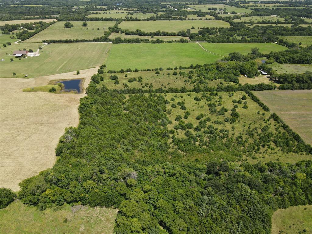 4145 County Road 4145 Bonham, TX 75418 - Photo 4 of 10 a view of a lake with a houses