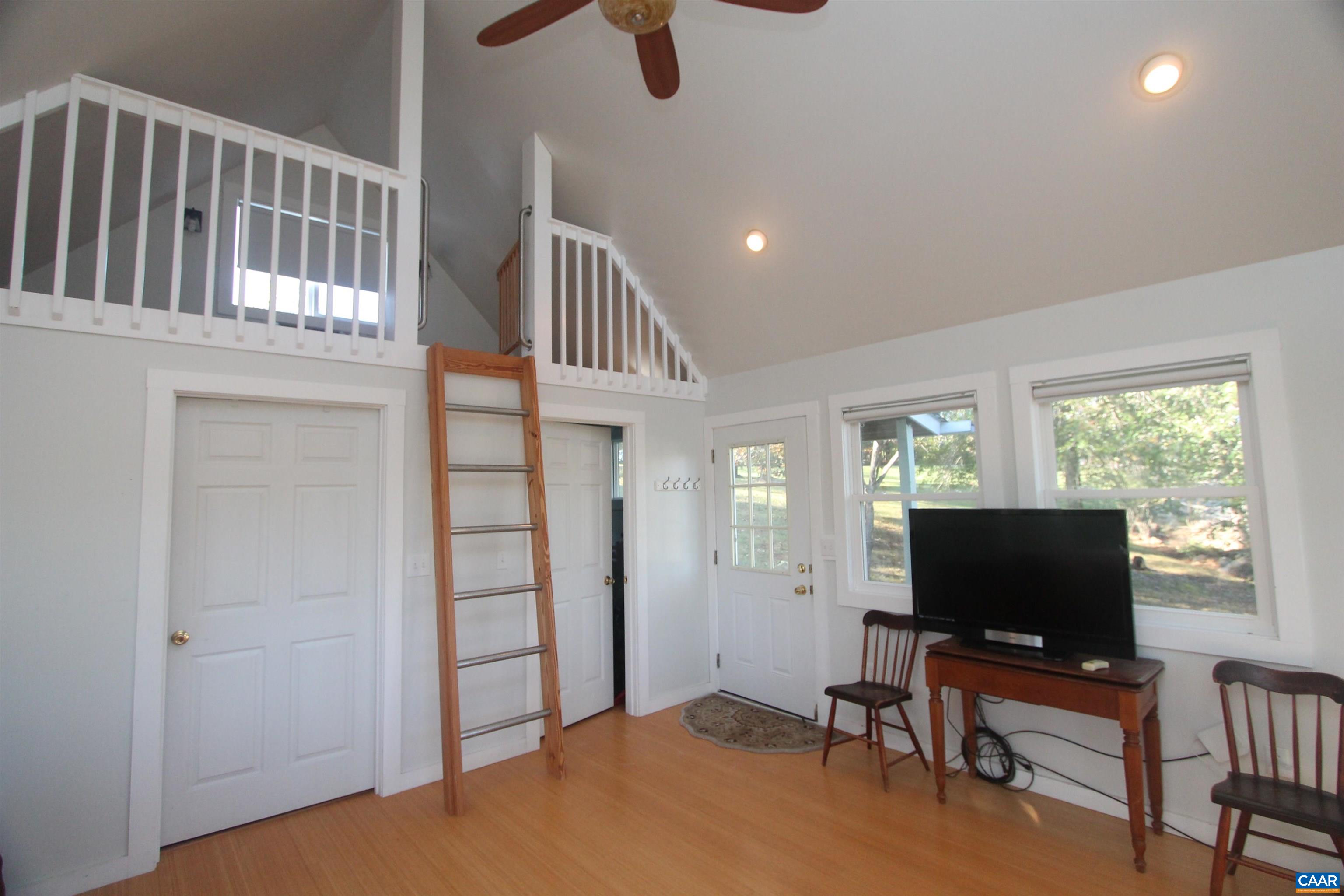 Tbd Batesville Road Afton, VA 22920 - Photo 5 of 16 an empty room with windows flat screen tv and windows