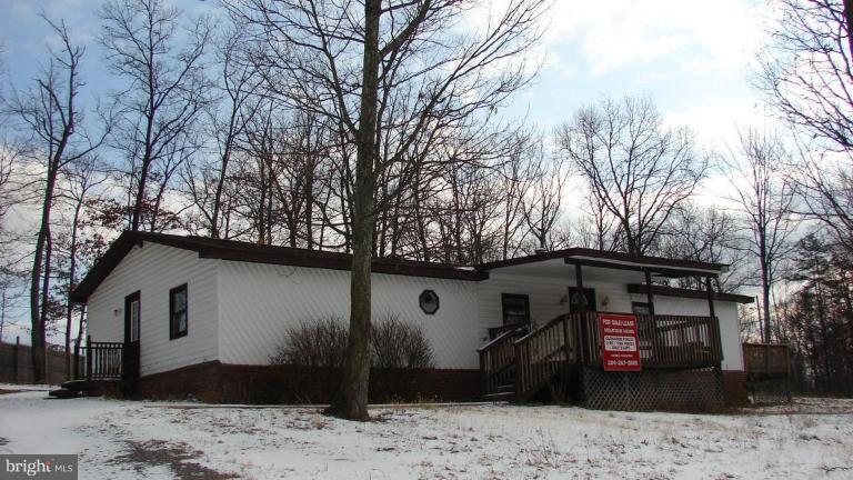 91 Ball Run Road Great Cacapon, WV 25422 - Photo 2 of 26 a front view of a house with a yard