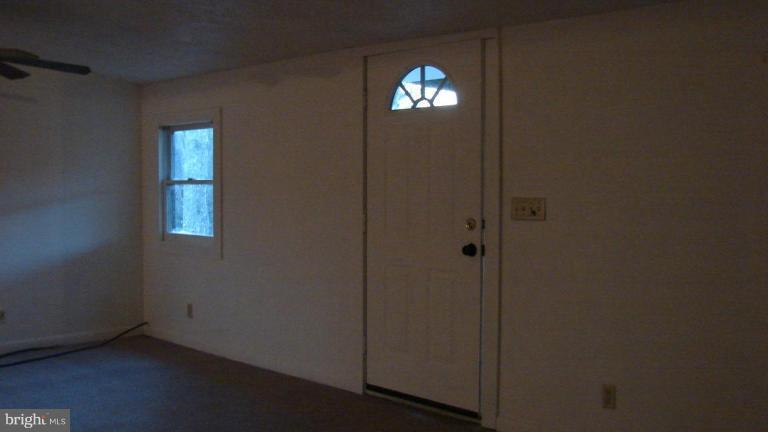 91 Ball Run Road Great Cacapon, WV 25422 - Photo 14 of 26 a view of empty room with window