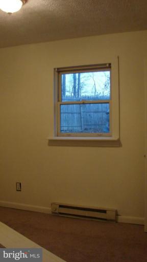 91 Ball Run Road Great Cacapon, WV 25422 - Photo 22 of 26 a view of a small space with wooden floor and a window