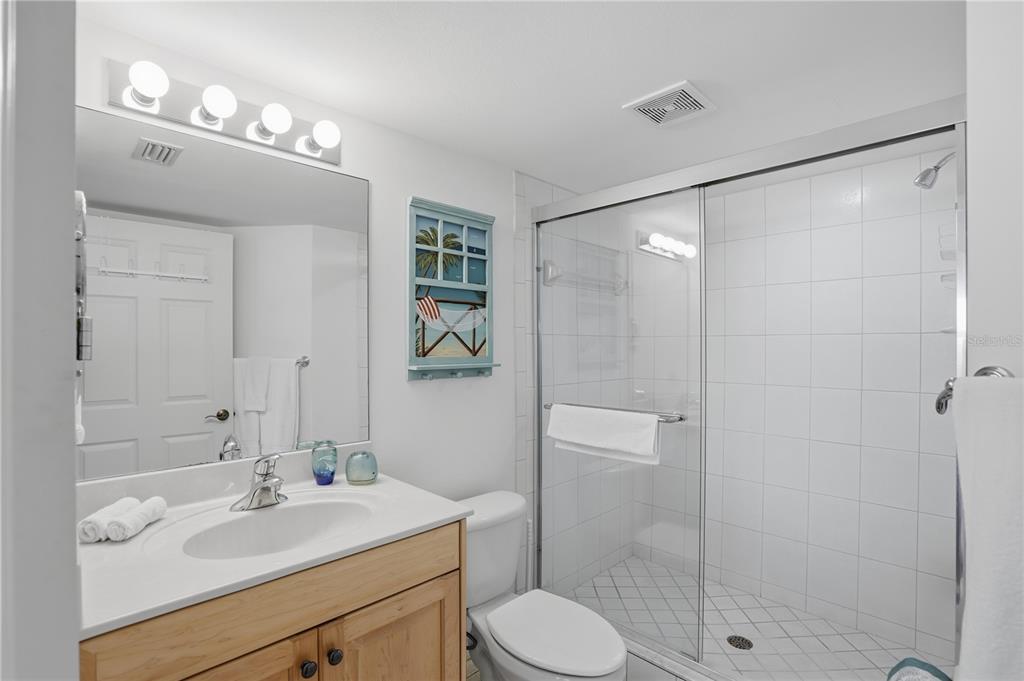 16326 Gulf Boulevard, Unit 307 Redington Beach, FL 33708 - Photo 24 of 43 a bathroom with a sink toilet and shower