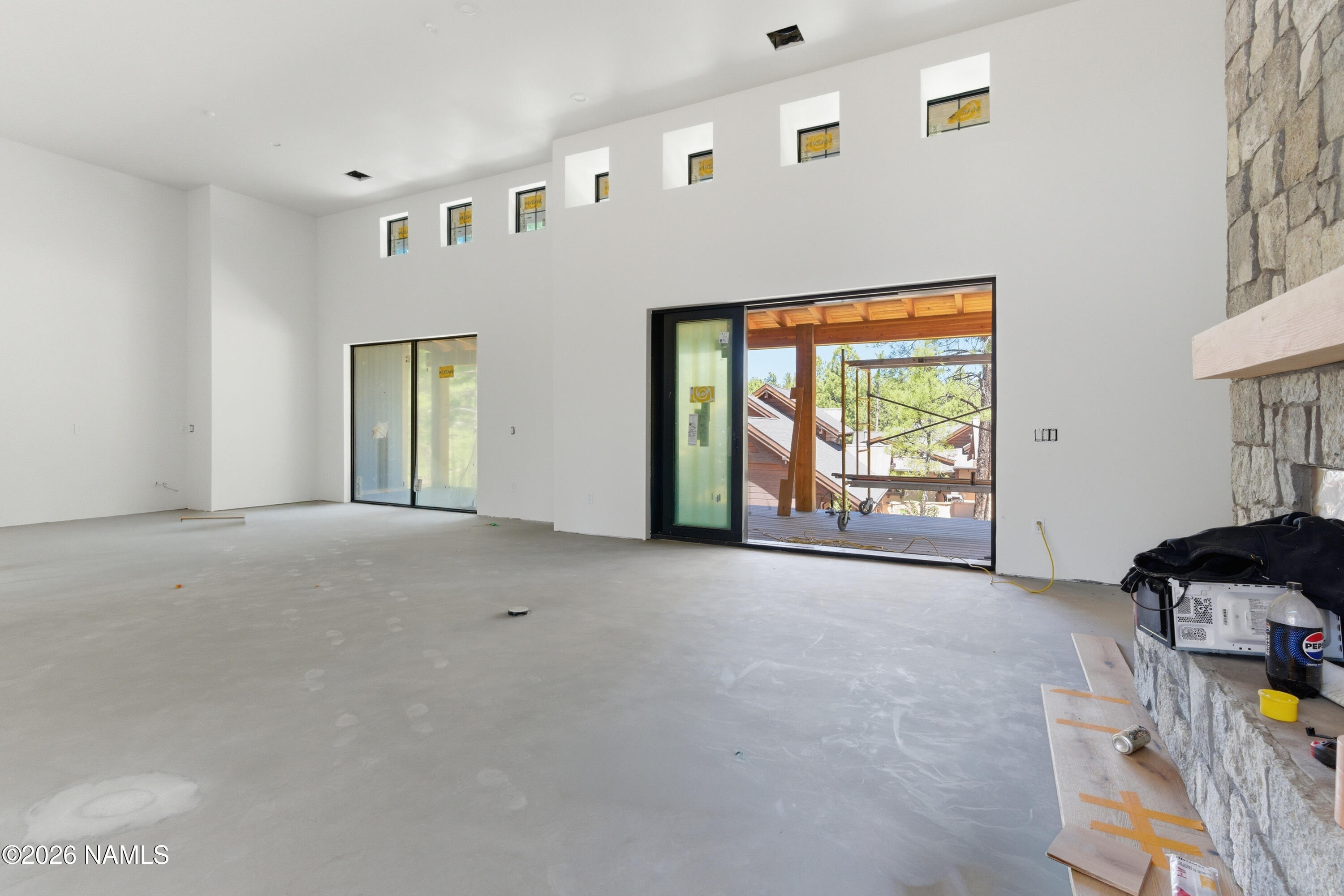 2380 East Del Rae Drive Flagstaff, AZ 86005 - Photo 7 of 26 a view of an empty room with windows
