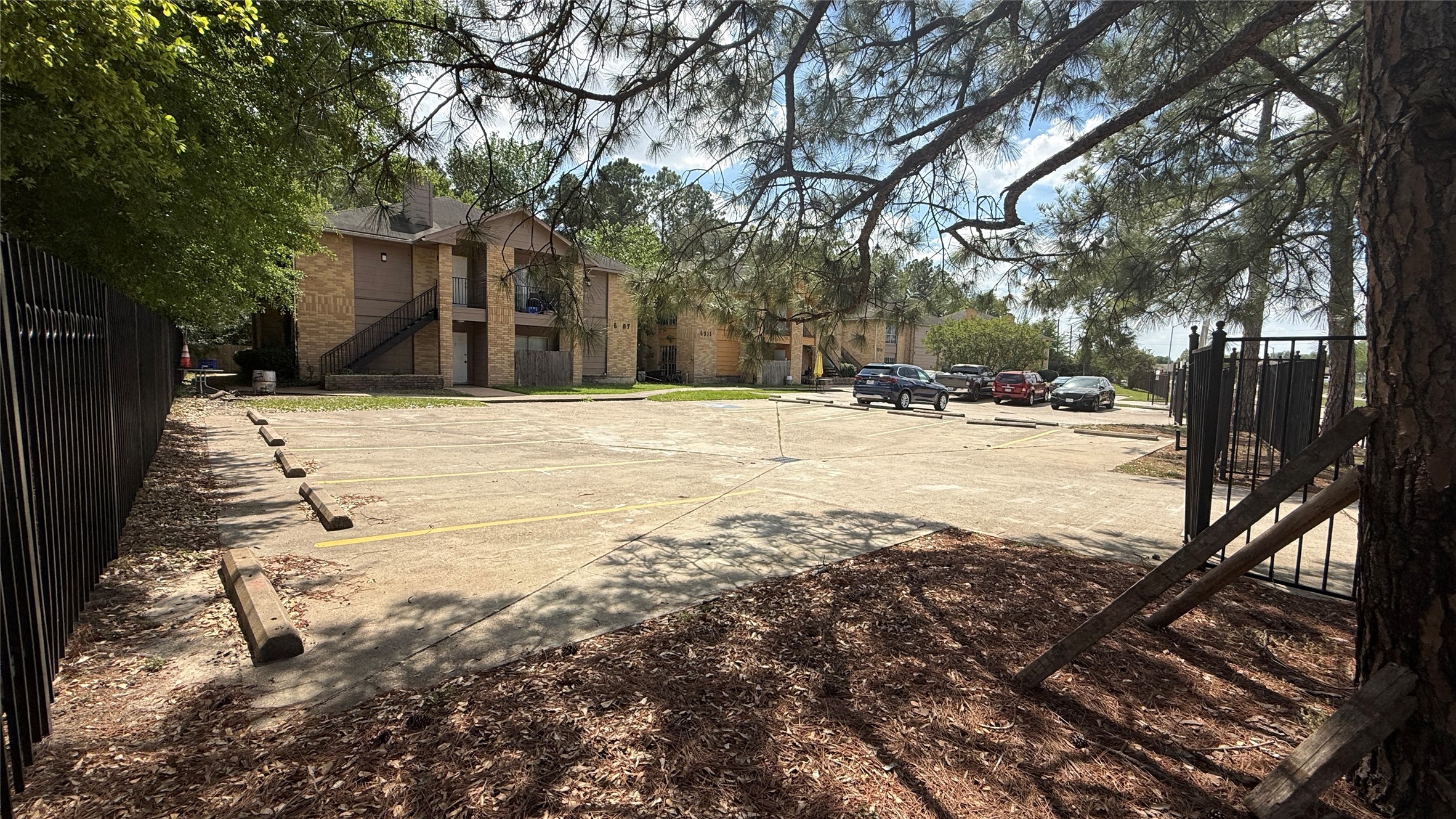 6307 West Gulf Bank Road, Unit 16 Houston, TX 77088 - Photo 2 of 9 a view of a yard with trees