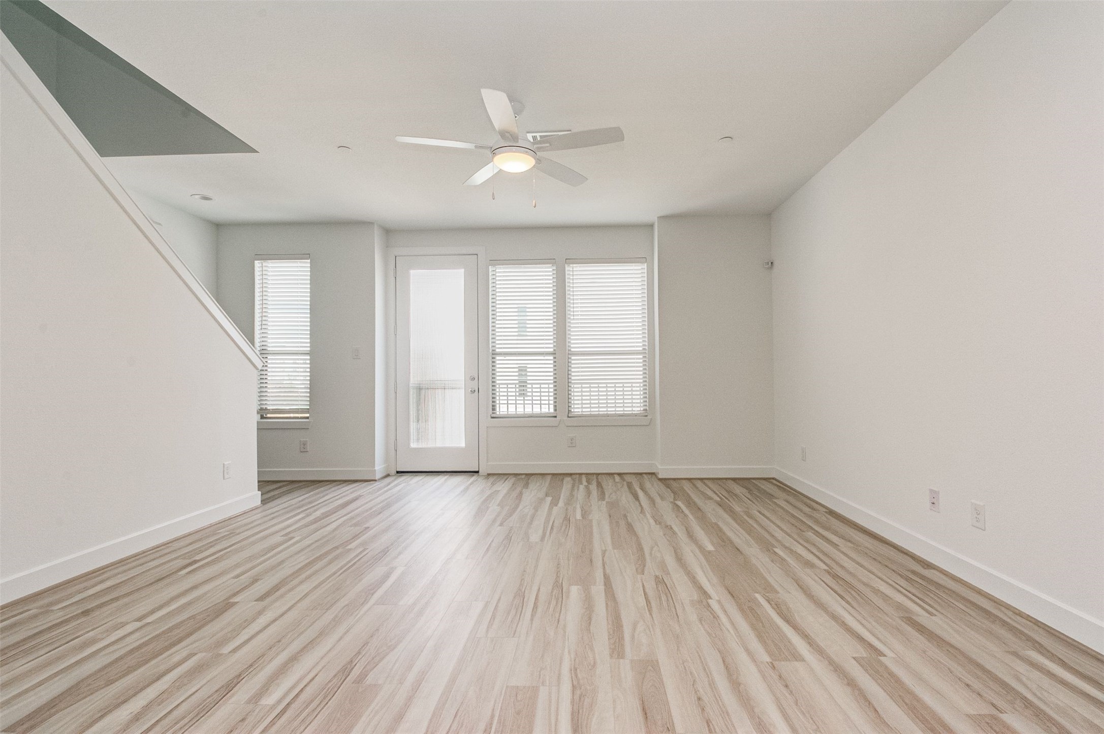 482 South Centro Circle Conroe, TX 77385 - Photo 8 of 23 wooden floor in an empty room with a window