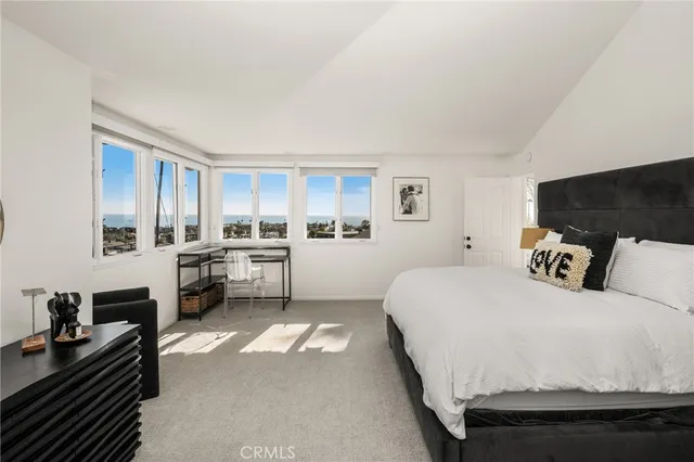 a view of a balcony with two chairs and a table