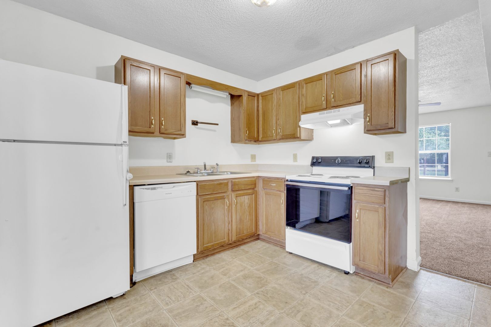 269 State Line Road Oak Grove, KY 42262 - Photo 6 of 16 a kitchen with stainless steel appliances a refrigerator sink and stove