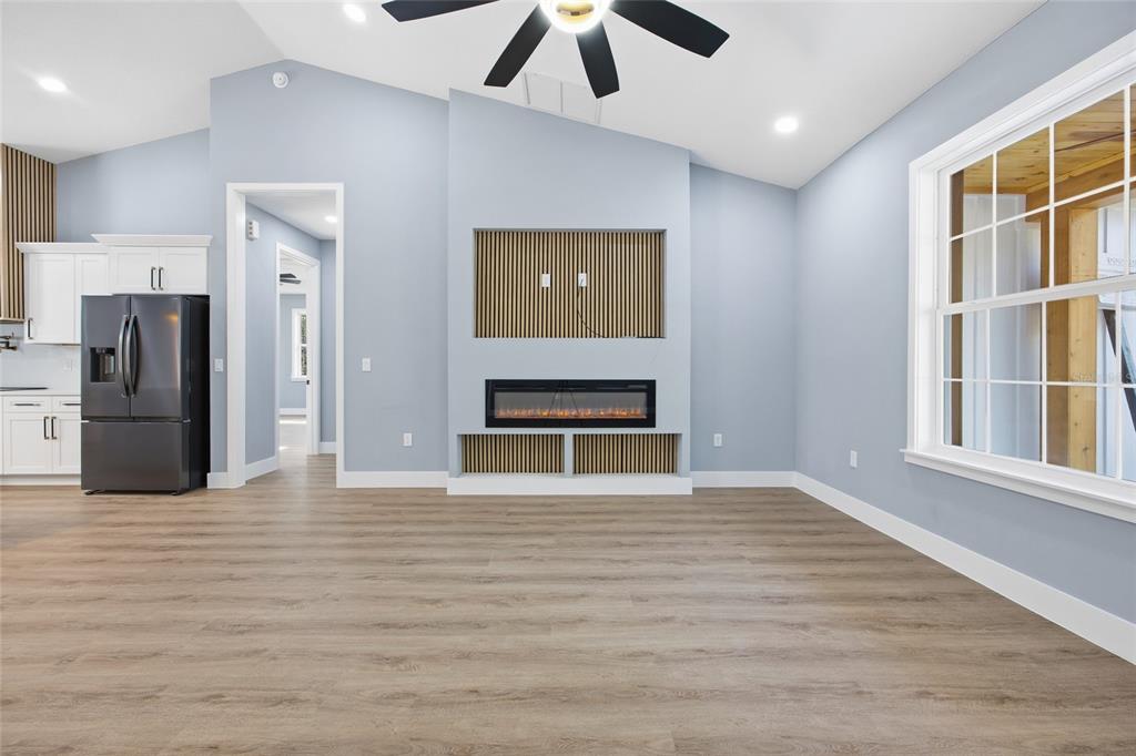 13186 Southwest 52nd Lane Road Ocala, FL 34481 - Photo 11 of 37 a view of an empty room with a window and kitchen view