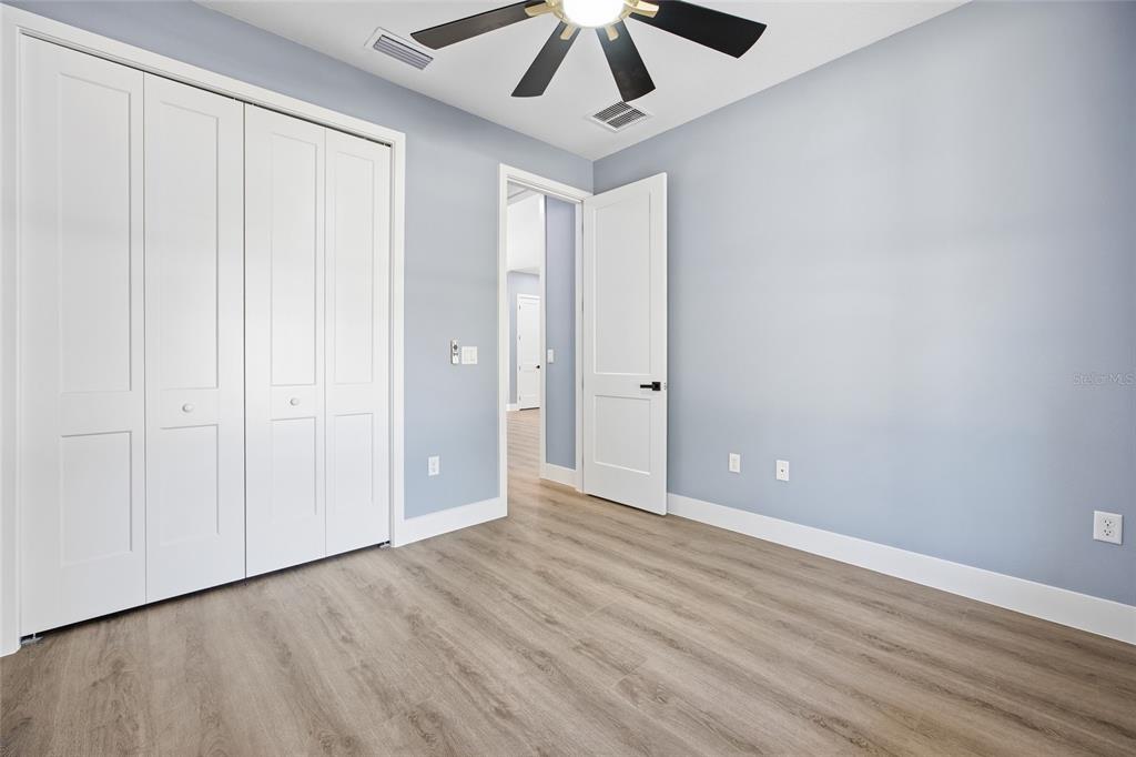 13186 Southwest 52nd Lane Road Ocala, FL 34481 - Photo 16 of 37 a view of an empty room with wooden floor