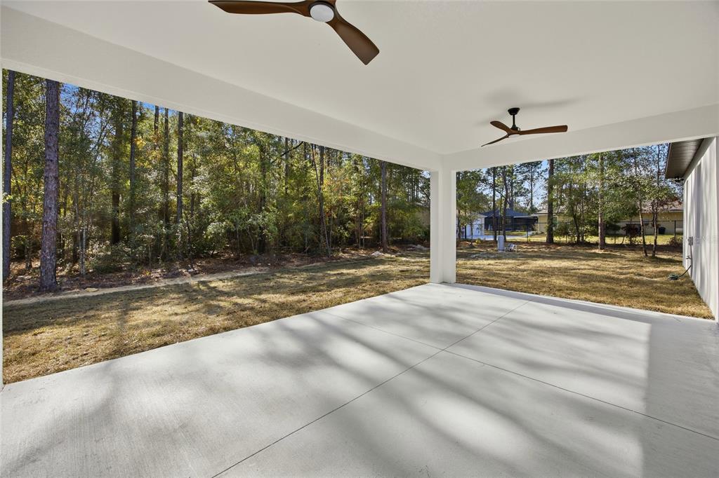 13186 Southwest 52nd Lane Road Ocala, FL 34481 - Photo 31 of 37 a view of a living room and floor to ceiling window