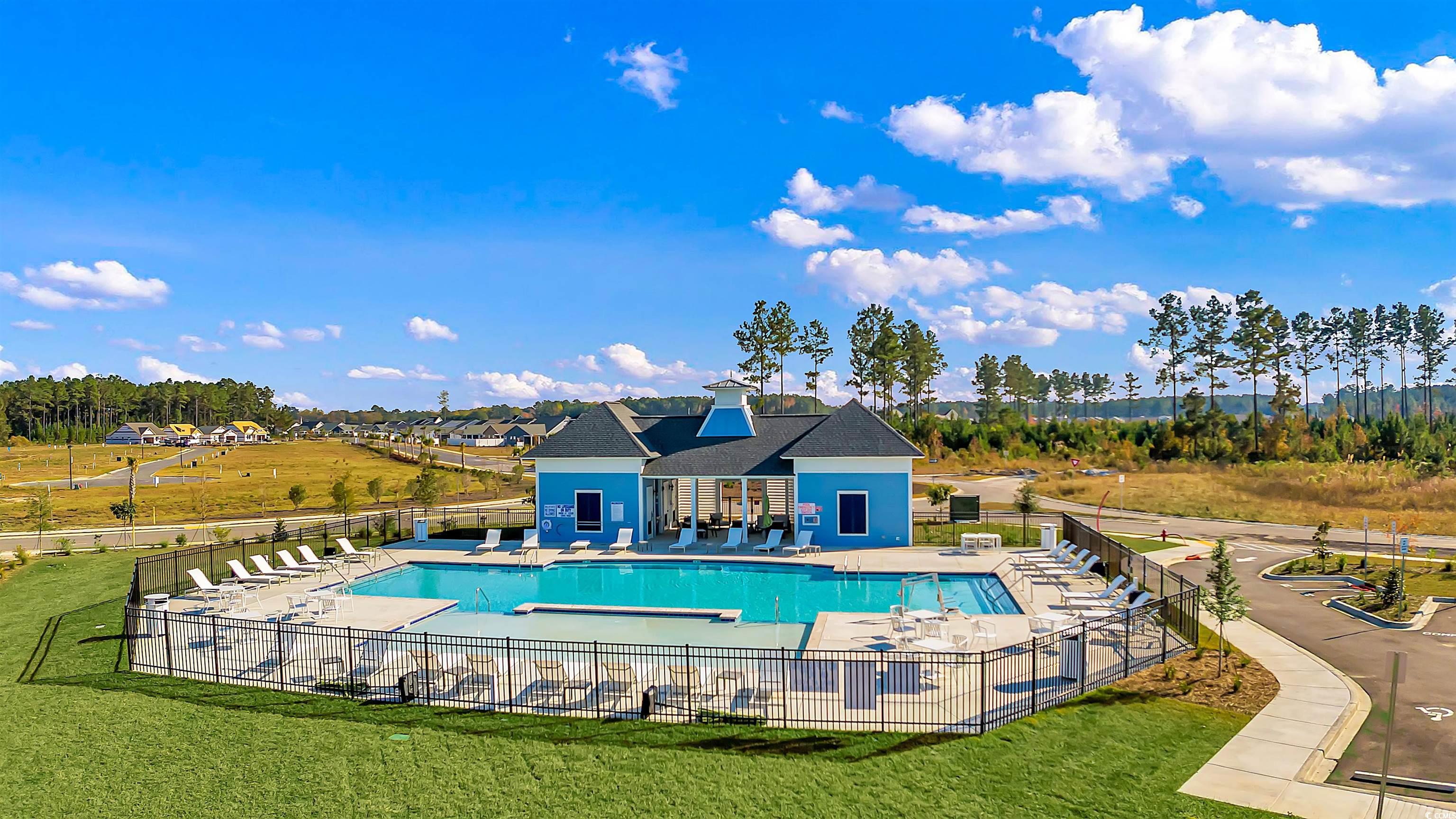 2171 Gooseberry Way Longs, SC 29568 - Photo 4 of 8 View of swimming pool with a patio area and a lawn