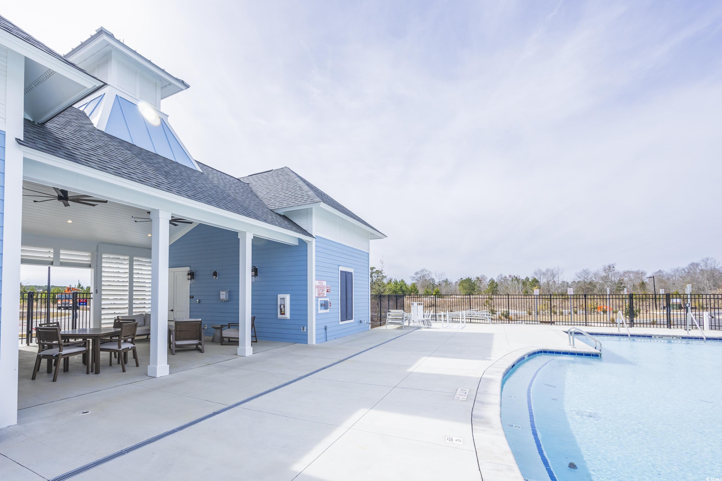2171 Gooseberry Way Longs, SC 29568 - Photo 5 of 8 View of pool with a lawn