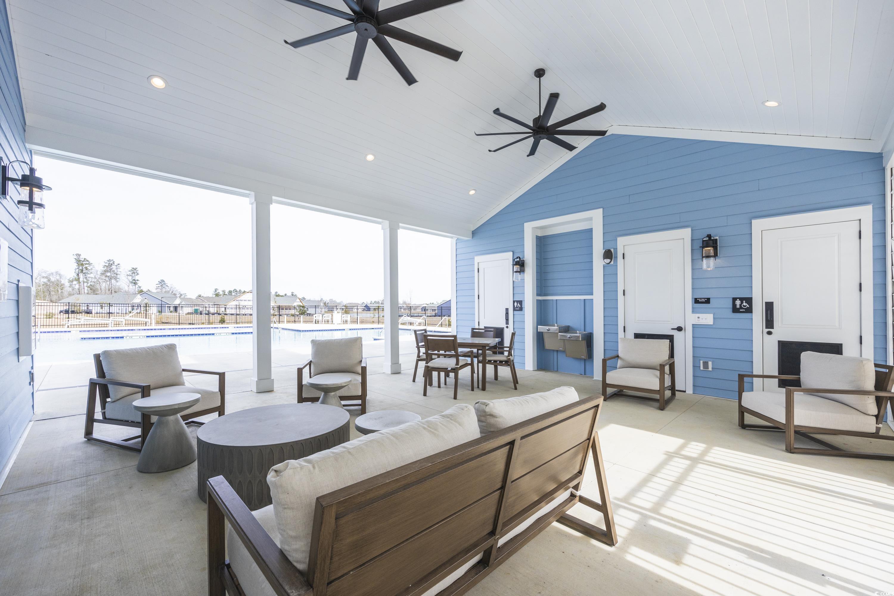 2171 Gooseberry Way Longs, SC 29568 - Photo 6 of 8 View of swimming pool with ceiling fan and a patio