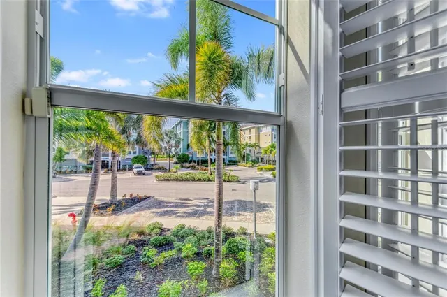 a living room with furniture and a book shelf