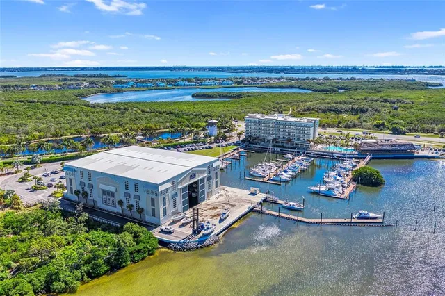 a dining room with furniture window and wooden floor