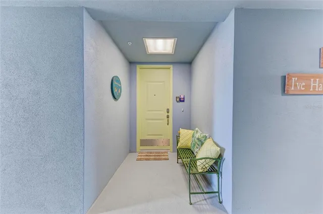 a large kitchen with stainless steel appliances kitchen island granite countertop a refrigerator and a stove top oven