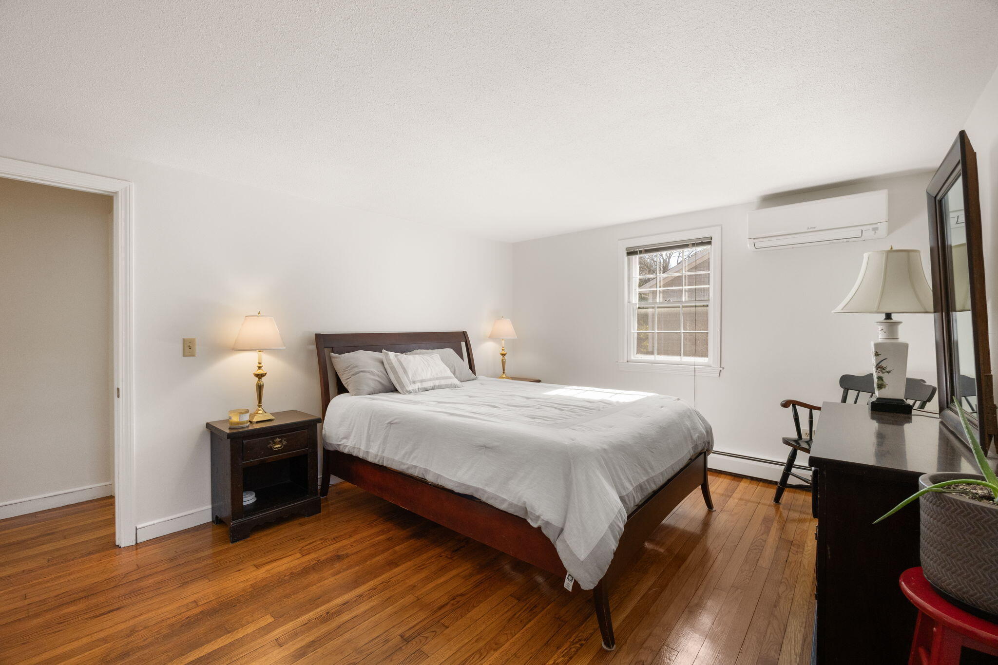 105 Annable Point Road Centerville, MA 02632 - Photo 18 of 27 a bedroom with a bed and wooden floor