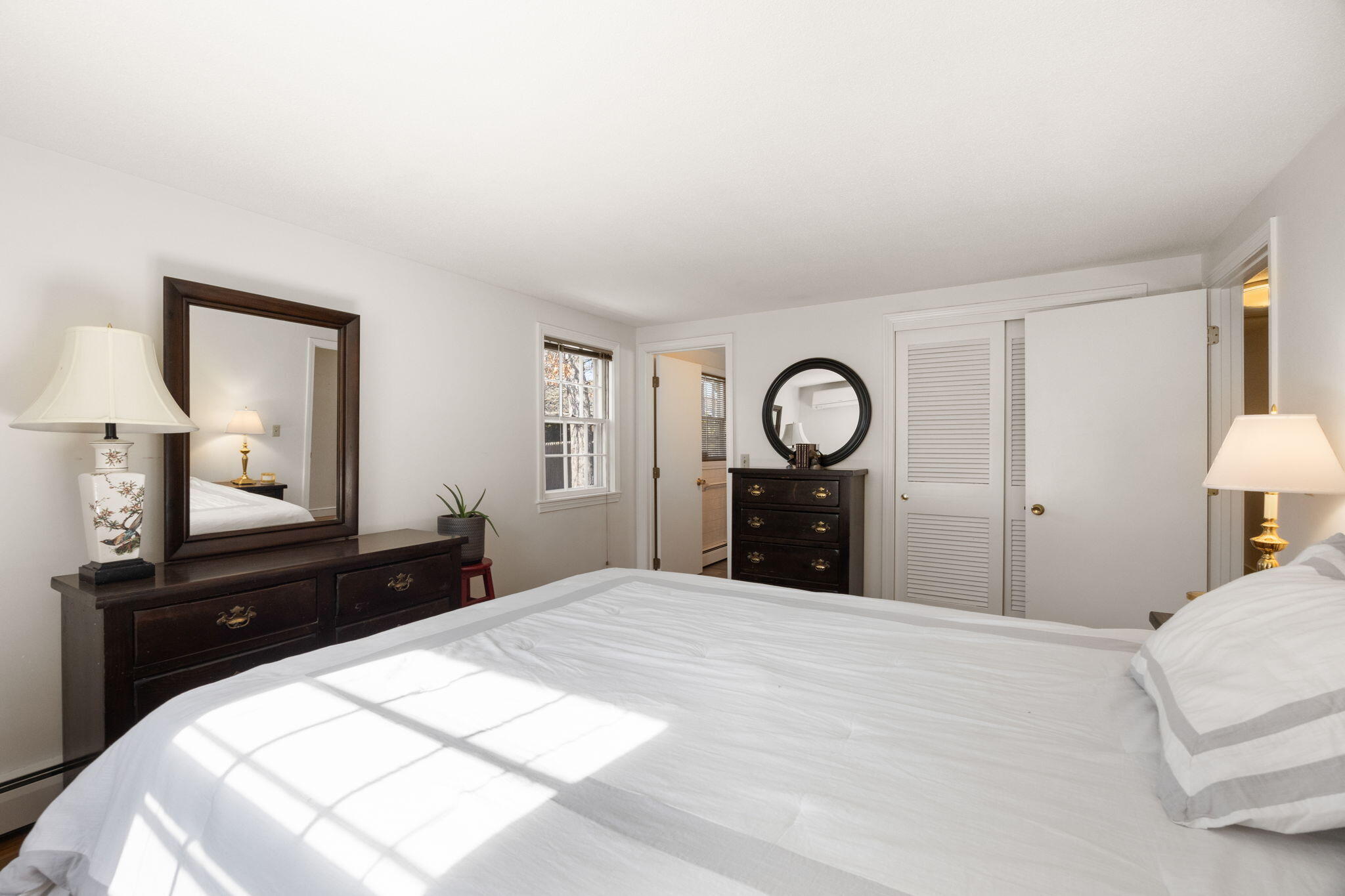 105 Annable Point Road Centerville, MA 02632 - Photo 19 of 27 a bedroom with a bed and a lamp