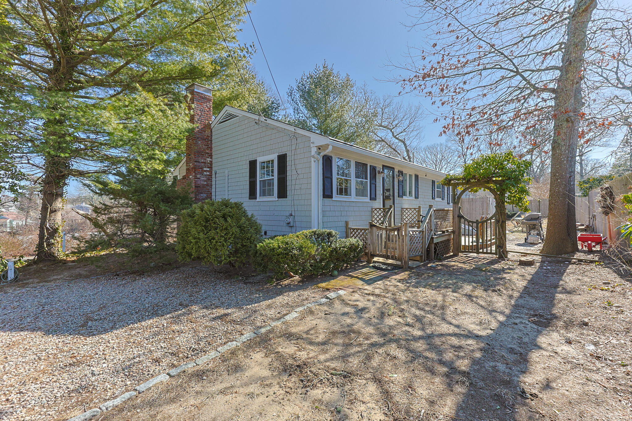 105 Annable Point Road Centerville, MA 02632 - Photo 21 of 27 a view of a house with a yard and large tree