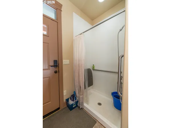 a bathroom with a tub and shower