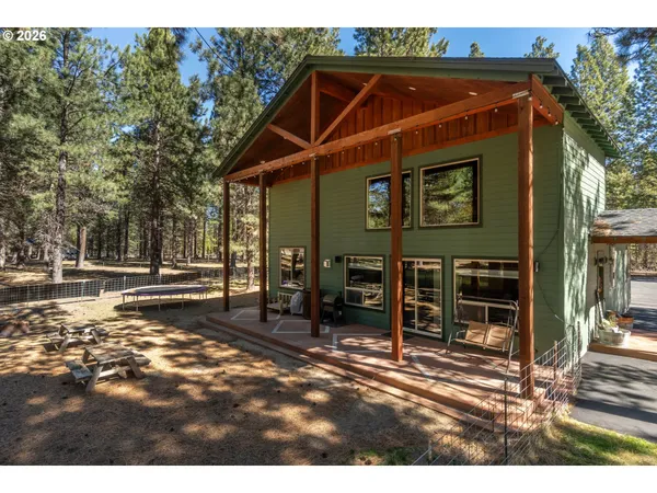 a view of a chairs and table in the patio