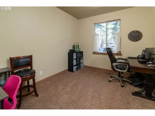 a workspace with furniture and window