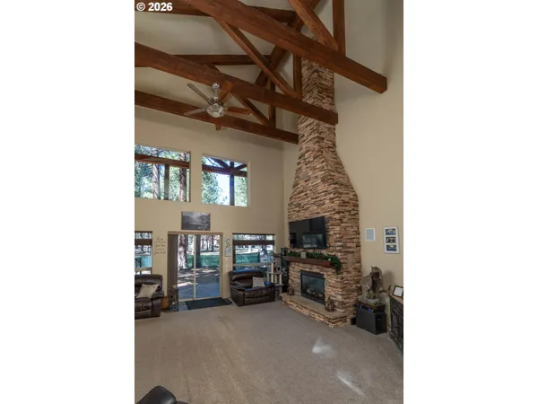 a view of livingroom with furniture and a fireplace
