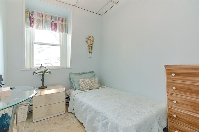 a bathroom with a bathtub and a window