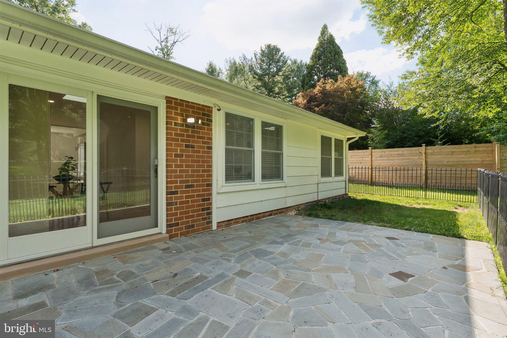 3219 Fox Mill Road Oakton, VA 22124 - Photo 61 of 87 Charming patio with lush greenery.