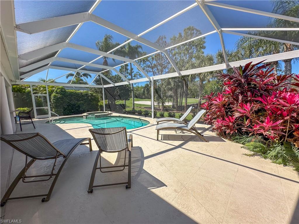 8229 Allendale Court Naples, FL 34120 - Photo 11 of 50 a view of a chairs and table in the patio