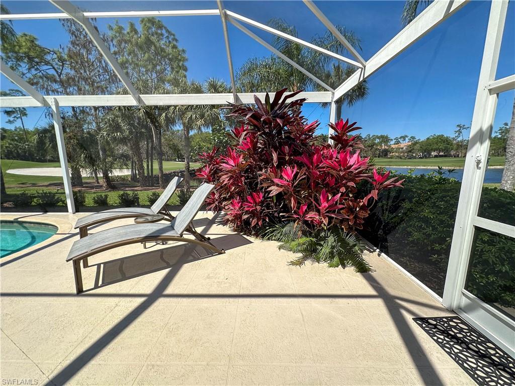 8229 Allendale Court Naples, FL 34120 - Photo 13 of 50 a view of a balcony with flower plants