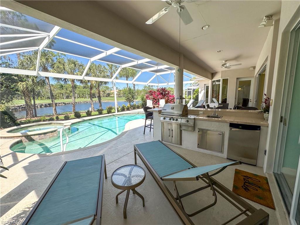 8229 Allendale Court Naples, FL 34120 - Photo 16 of 50 a dining room with stainless steel appliances granite countertop a sink and a table