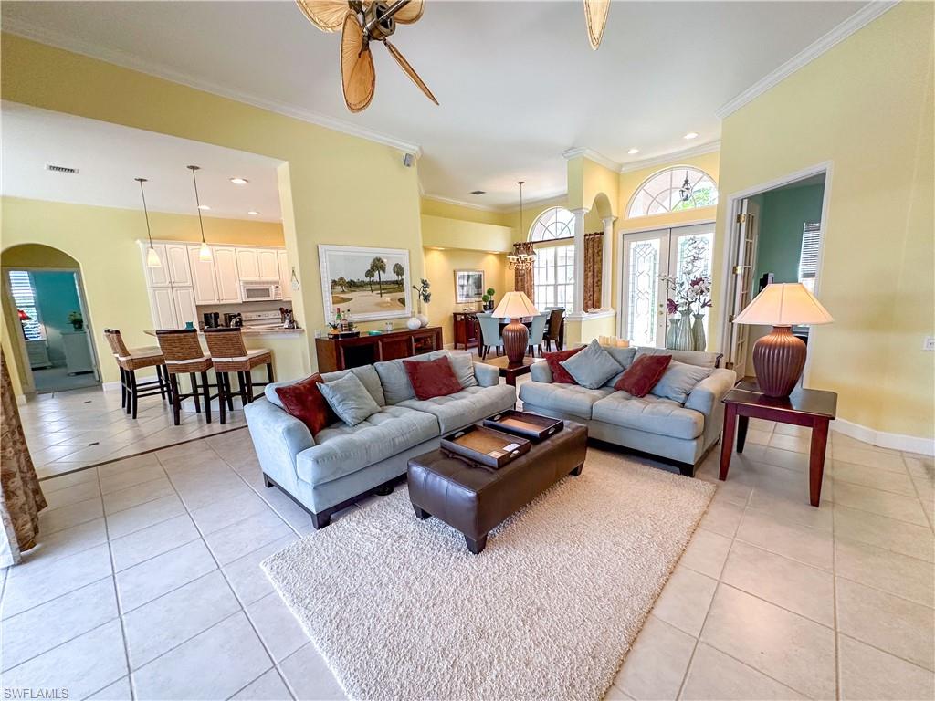 8229 Allendale Court Naples, FL 34120 - Photo 17 of 50 a living room with furniture and a dining table