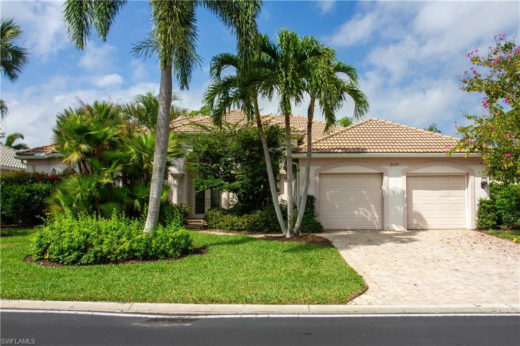8229 Allendale Court Naples, FL 34120 - Photo 2 of 50 a front view of a house with a yard and garage