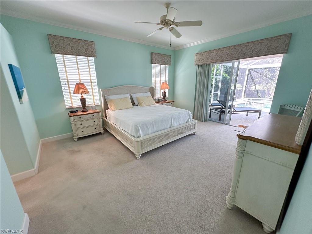 8229 Allendale Court Naples, FL 34120 - Photo 22 of 50 a spacious bedroom with a bed and window