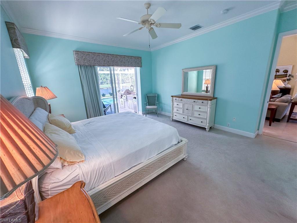 8229 Allendale Court Naples, FL 34120 - Photo 23 of 50 a bedroom with a bed and a window