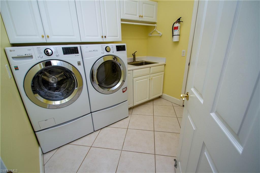 8229 Allendale Court Naples, FL 34120 - Photo 32 of 50 a utility room with dryer and washer
