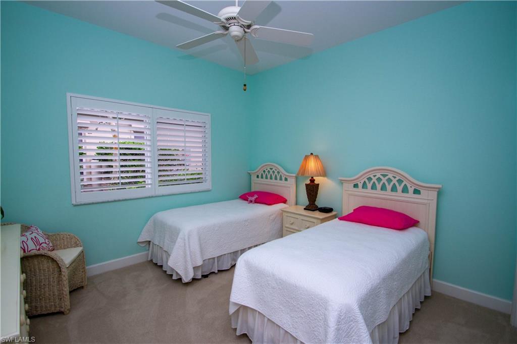 8229 Allendale Court Naples, FL 34120 - Photo 35 of 50 a bedroom with two beds and a window