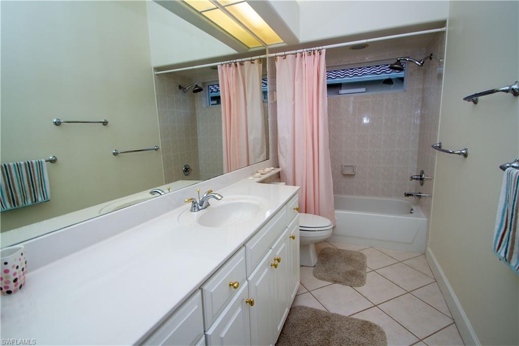 8229 Allendale Court Naples, FL 34120 - Photo 37 of 50 a bathroom with a sink a toilet and shower